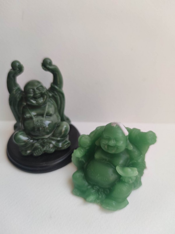 Feng Shui set for attracting money and luck in the home with laughing Buddha Hotei and candle